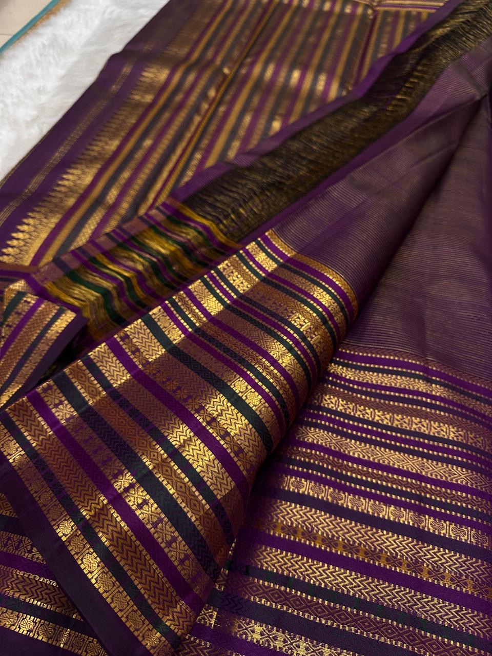 Pallu of the Kanjeevaram saree showing the full body Varisaipet intensifying in dense gold zari toward the hem