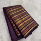 Detail of the Varisaipet geometric diamond and floral band structure in gold zari on the deep purple Kanjeevaram saree