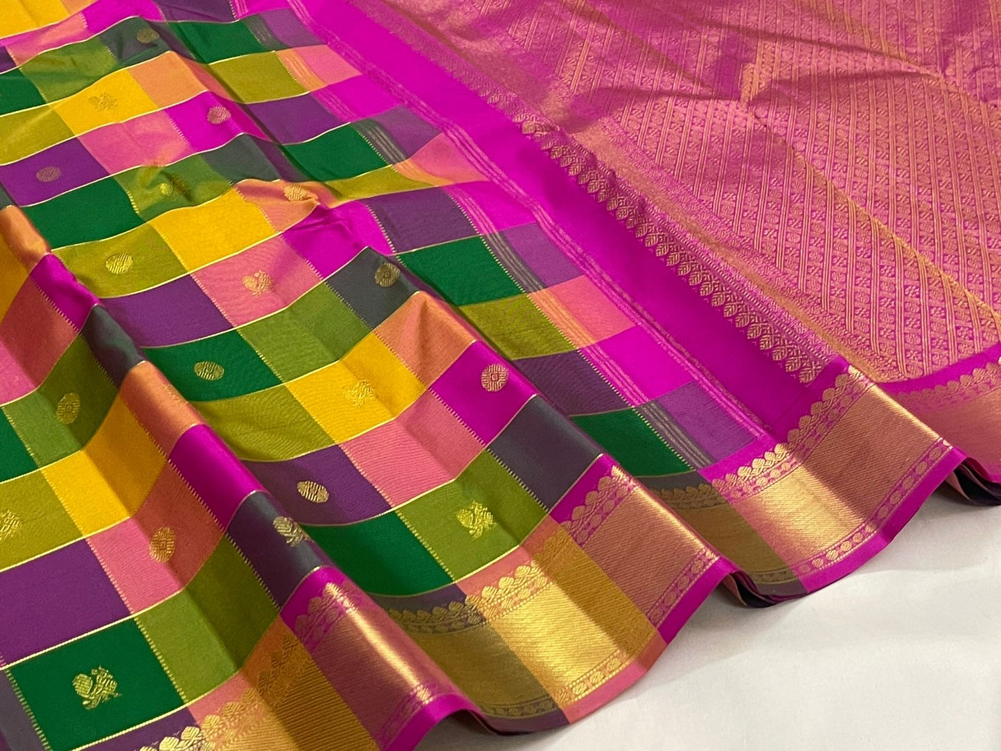 Magenta pallu of multicolour Paalum Pazhamum Korvai KanchiPattu saree with Kamalam butta — pallu close-up