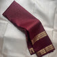 Handwoven Kanjipuram Rettapet saree in deep burgundy with Floral Butta and antique gold geometric zari border, full folded view