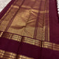 Burgundy Rettapet border with twin parallel zari lines and geometric chevron gold zari — Kanjipuram detail