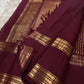 Full folded view of burgundy Kanjipuram Rettapet saree showing Floral Butta body and self-colour border