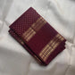 Antique gold geometric zari chevron detail in burgundy Rettapet border — Kanjipuram handwoven silk