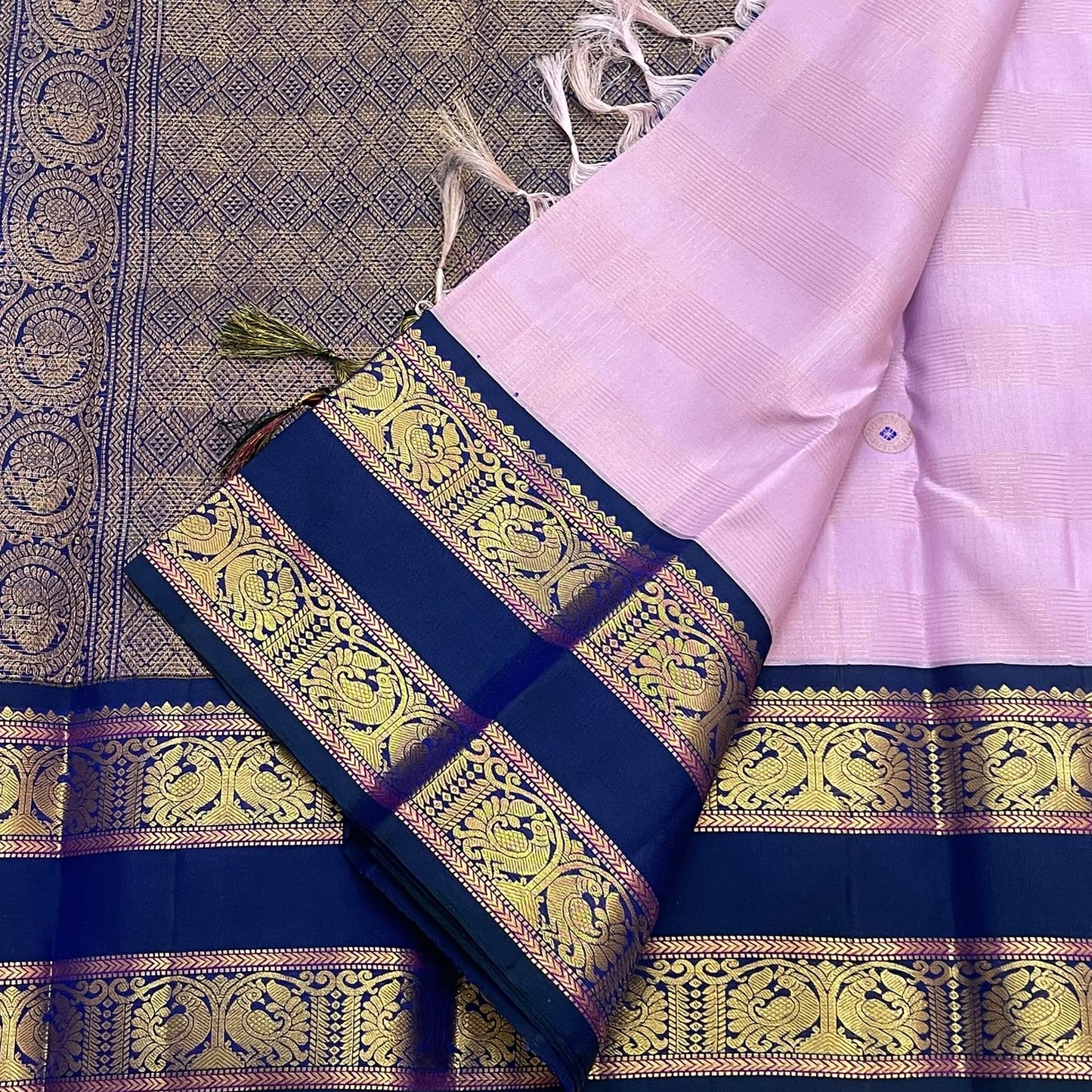 Antique gold Mayil Butta peacock and floral scroll pallu on deep navy Rettapet — Kanjipuram Butta lavender saree