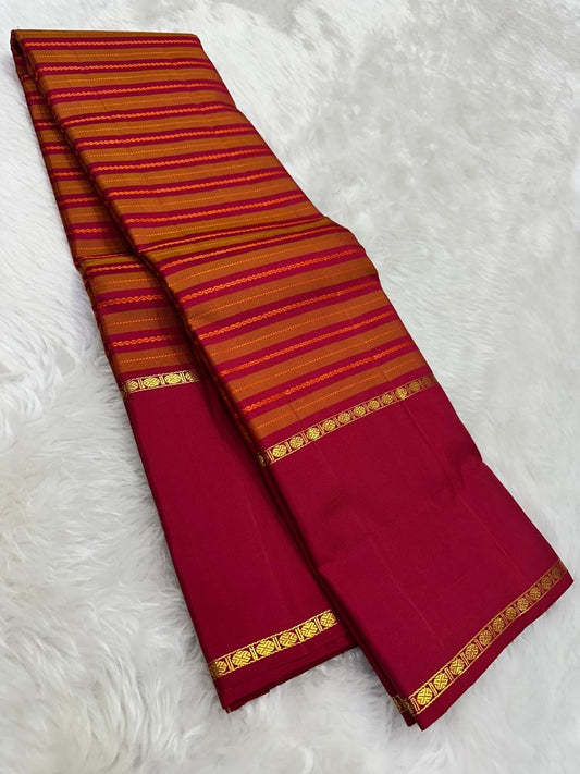 Pallu detail of orange and arakku red pure silk Kanjipuram saree showing arakku red Korvai border with antique gold zari band