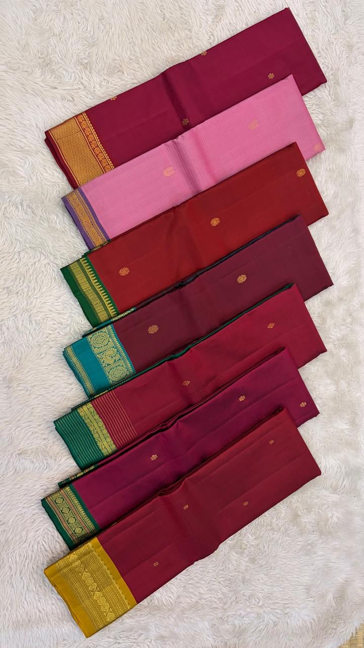Bottle green Varisaipet Korvai border of the Kanchi Pattu lightweight saree with horizontal gold zari bands and central floral band