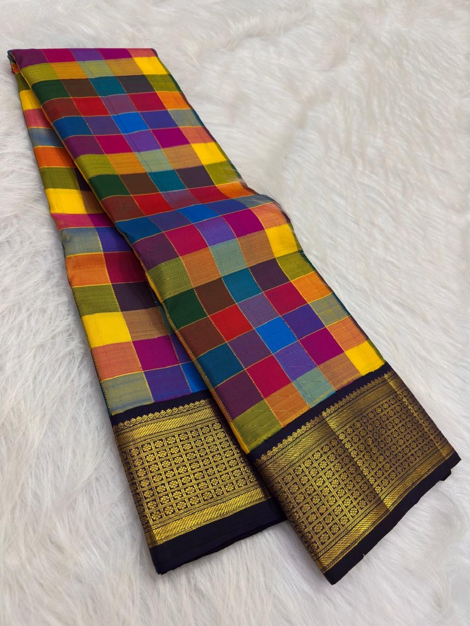 Handwoven Kanjivaram Paalum Pazhamum saree in multicolour silk checks with deep navy Rettapet gold zari border, full folded view
