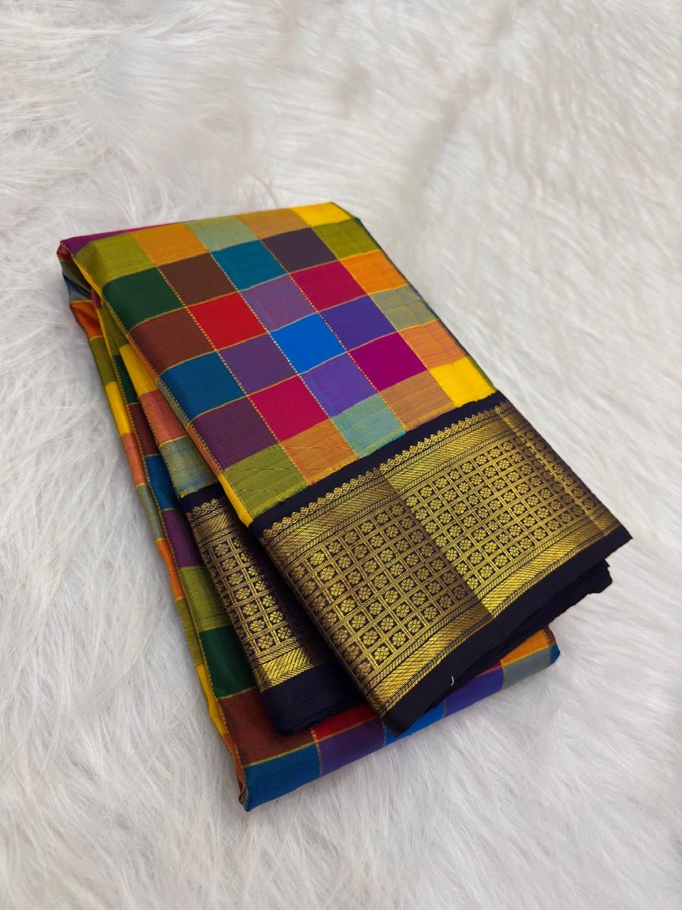 Close-up of multicolour Paalum Pazhamum silk check body — blue, purple, red, orange, magenta woven squares
