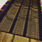 Full folded view of multicolour Paalum Pazhamum Kanjivaram saree showing check body and deep navy border contrast