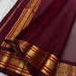 Folded view of the handwoven steel grey and maroon Kanjivaram pure silk saree showing woven stripe body and Varisaipet Korvai border