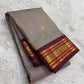 Handwoven pure silk Kanjivaram saree in steel grey with woven stripe body, Pavun Butta in gold zari, and maroon Varisaipet Korvai border — Idam Living