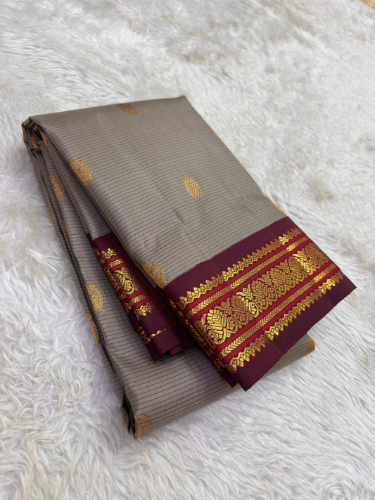 Handwoven pure silk Kanjivaram saree in steel grey with woven stripe body, Pavun Butta in gold zari, and maroon Varisaipet Korvai border — Idam Living