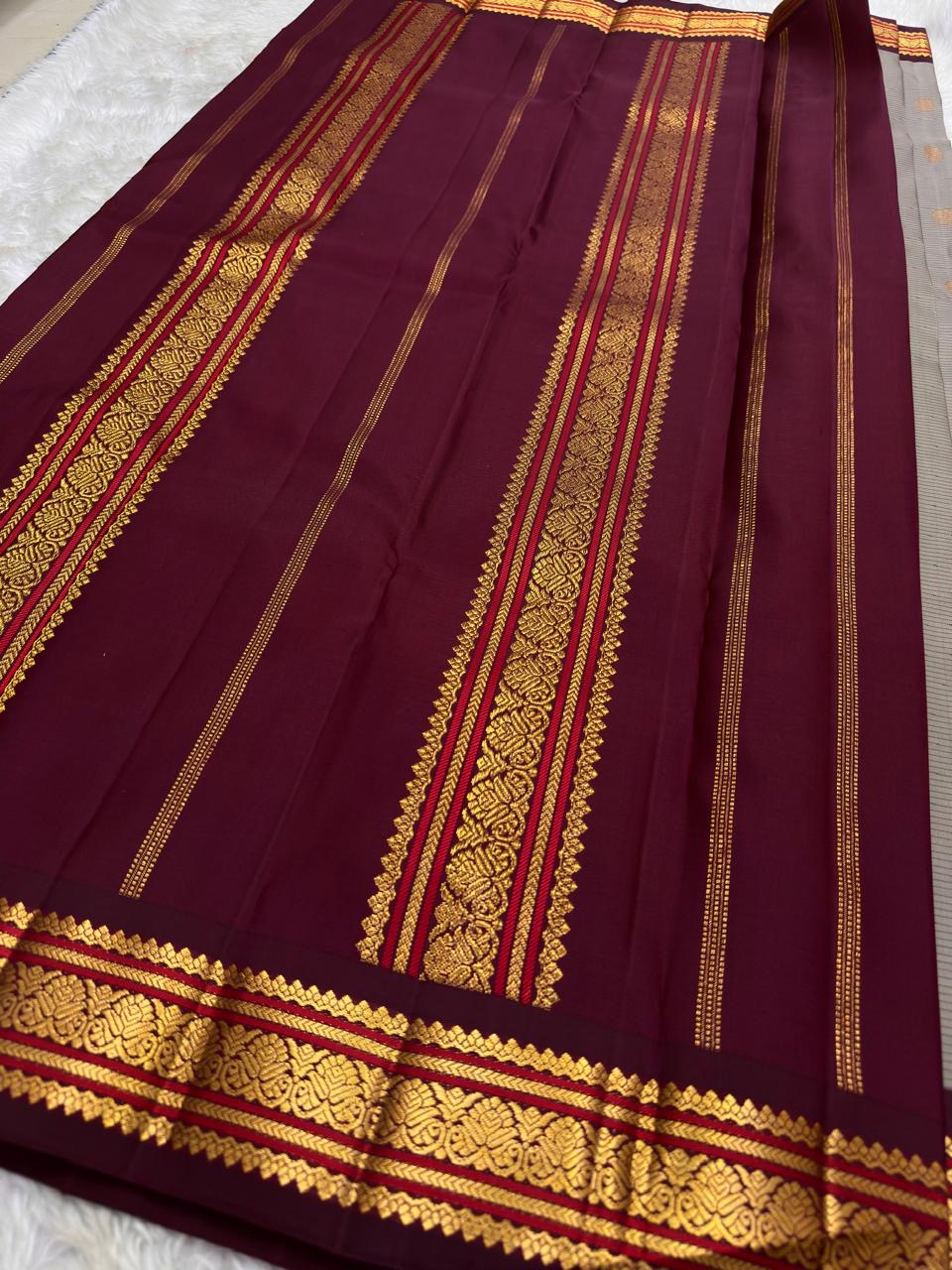 Pallu of the Kanjivaram saree in maroon with dense Varisaipet gold zari banding at full pallu scale