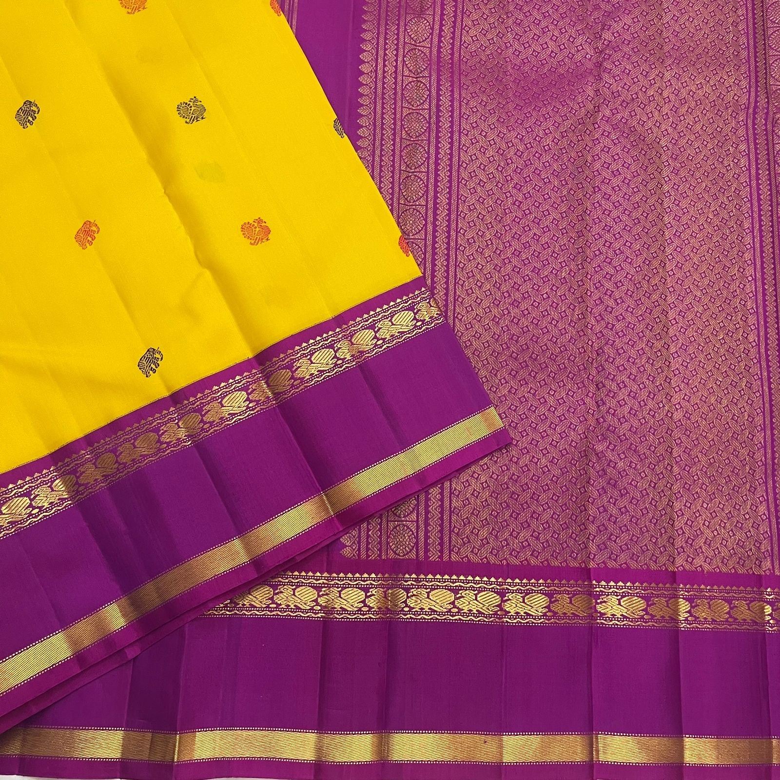 Silk thread butta detail on canary yellow handwoven pure silk Kancheepuram Rettapet saree — zari close-up