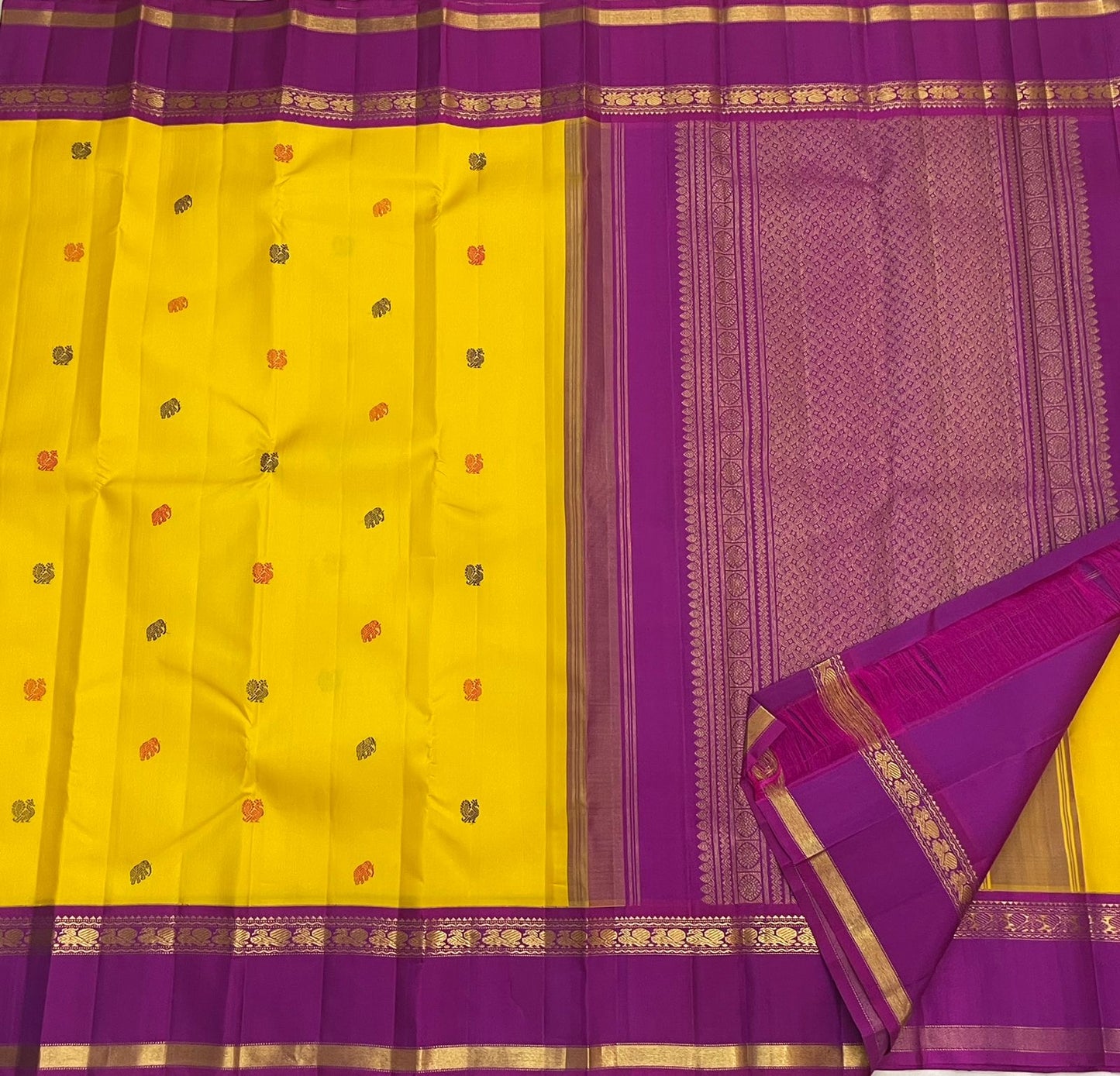 Violet pallu of canary yellow Kancheepuram Rettapet saree with silk thread butta — pallu close-up