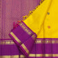 Canary yellow and violet Kancheepuram pure silk saree with Rettapet border and silk thread buttas — folded view