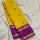 Multicolour silk thread Kamalam and Pavun buttas on canary yellow pure silk Kancheepuram Rettapet saree — body close-up