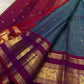 Pallu detail of teal and arakku red pure silk Kanjivaram saree showing antique gold zari elephant procession in arakku red Rettapet border