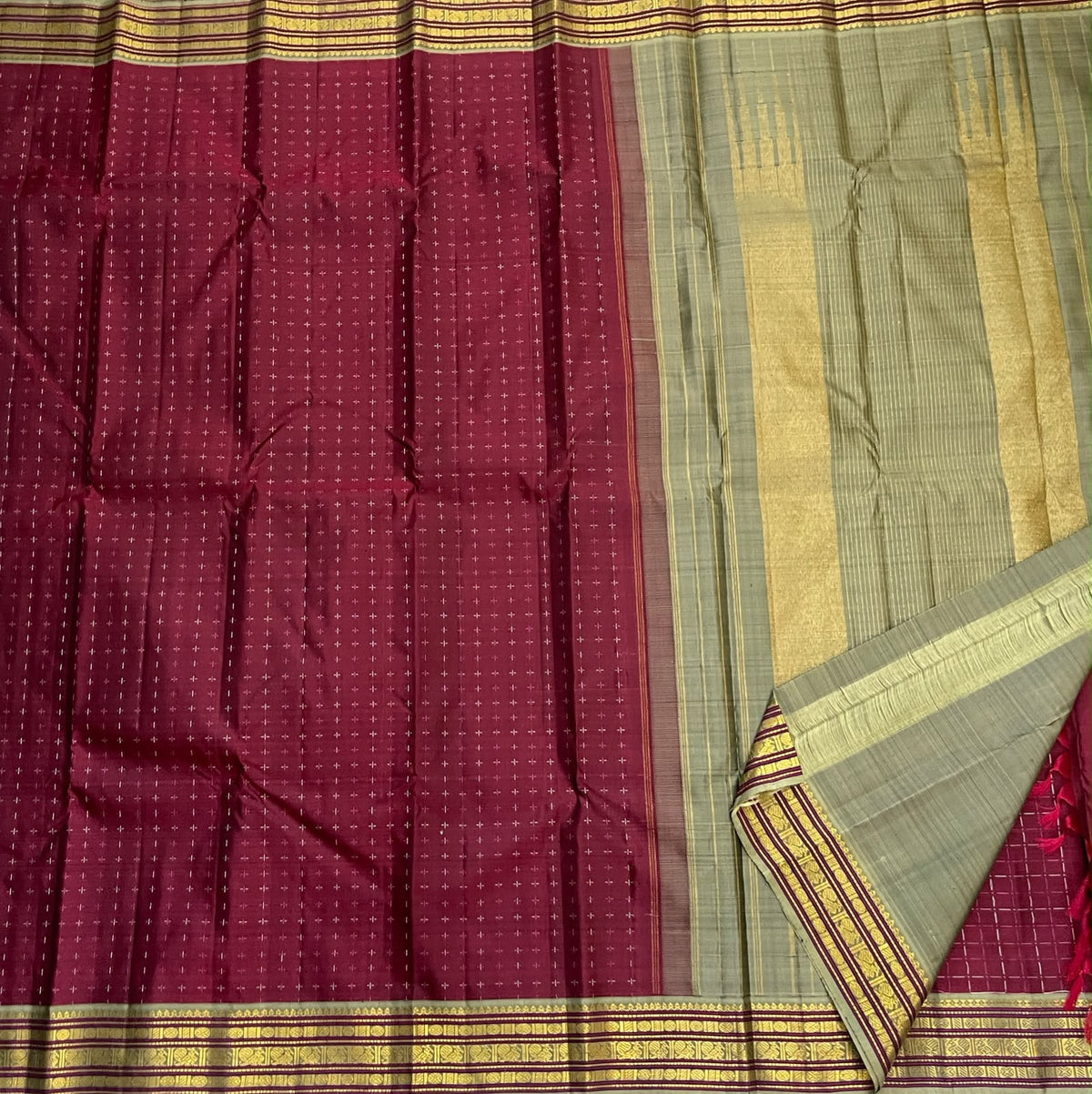 Deep Arakku Kanjeevaram saree with Rudraksham, Mayil Arai Maadam and Mulla Moggu zari border