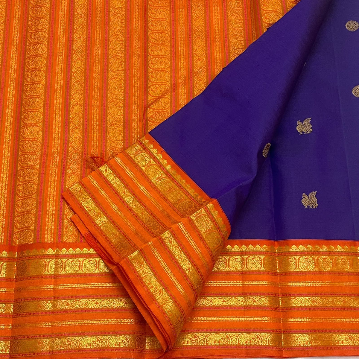 Royal purple Kanjeevaram Varisaipet saree with antique-gold zari bands