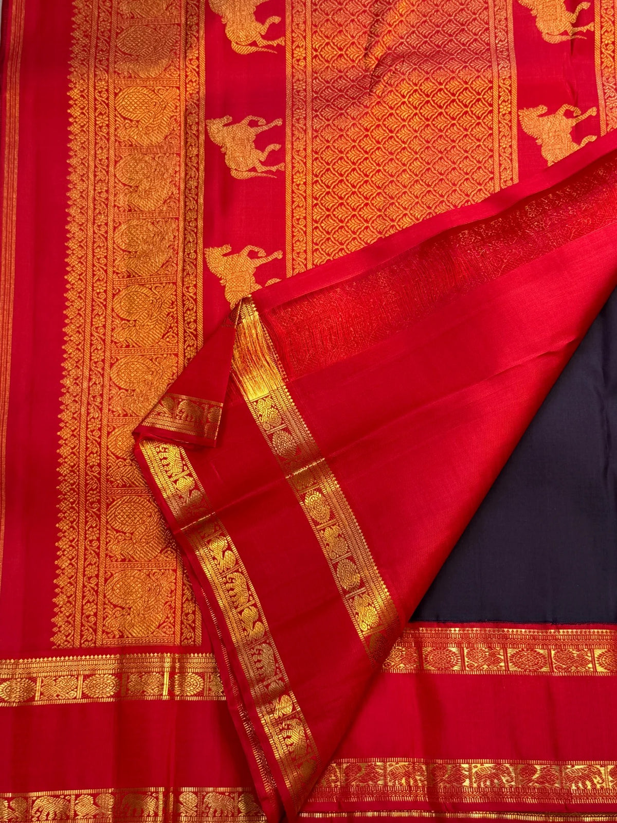 Deep violet and vermilion red Kanchipuram Rettapet saree with horse and peacock zari pallu