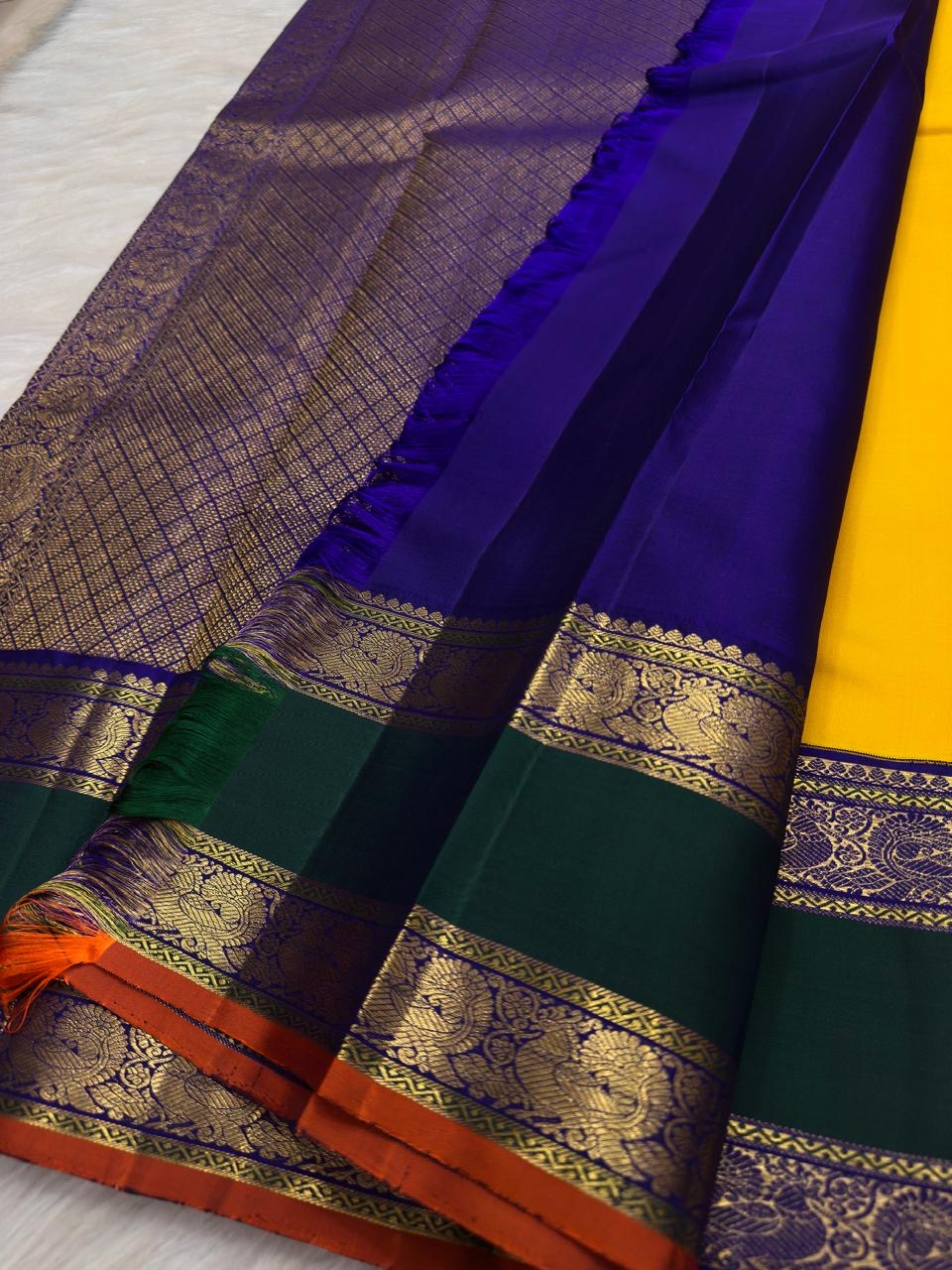 Kamalam zari buttas on turmeric yellow pure silk Kanjivaram body