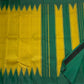 Emerald green pallu of golden mustard Pattupet Kancheepuram saree