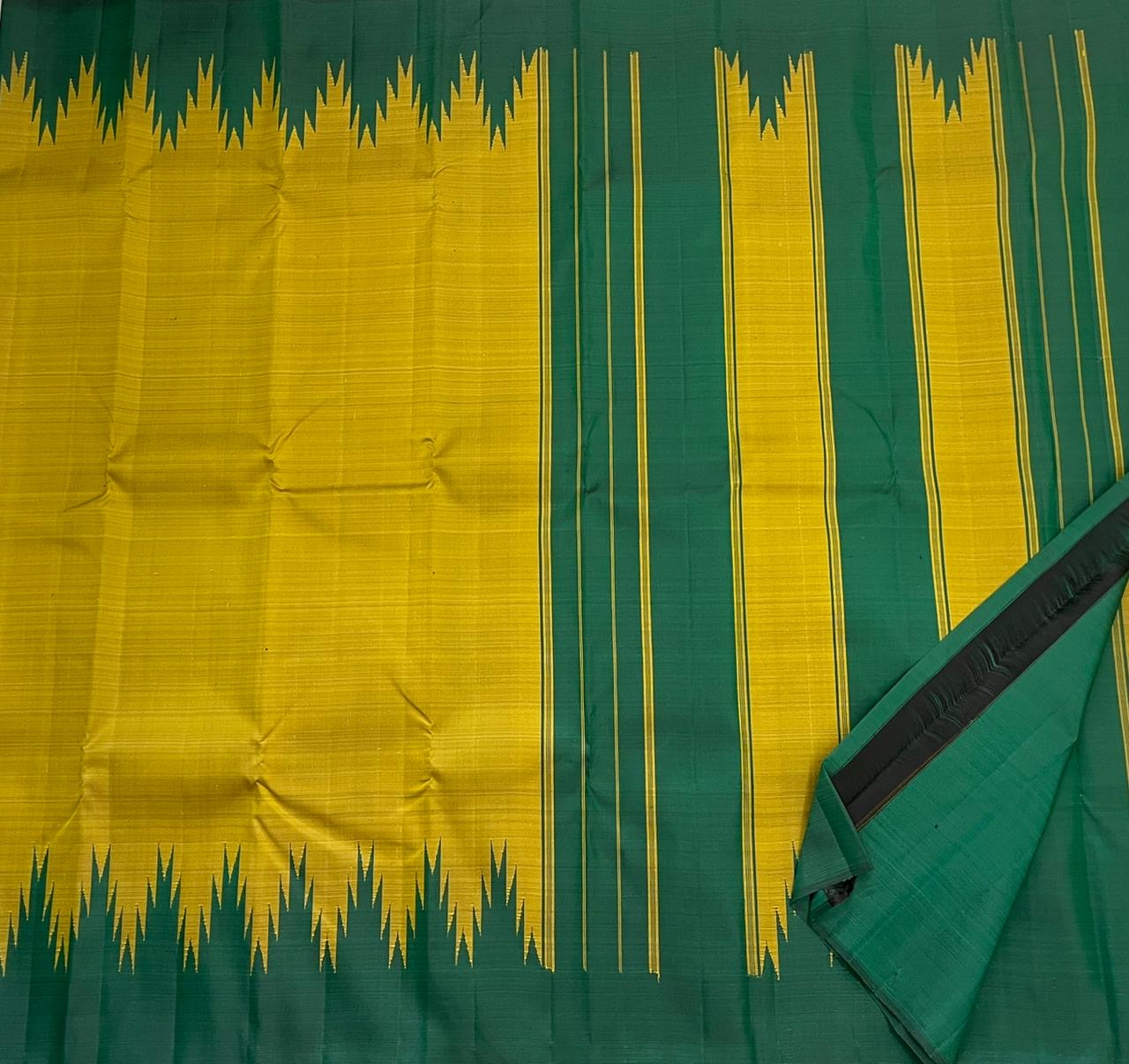 Emerald green pallu of golden mustard Pattupet Kancheepuram saree