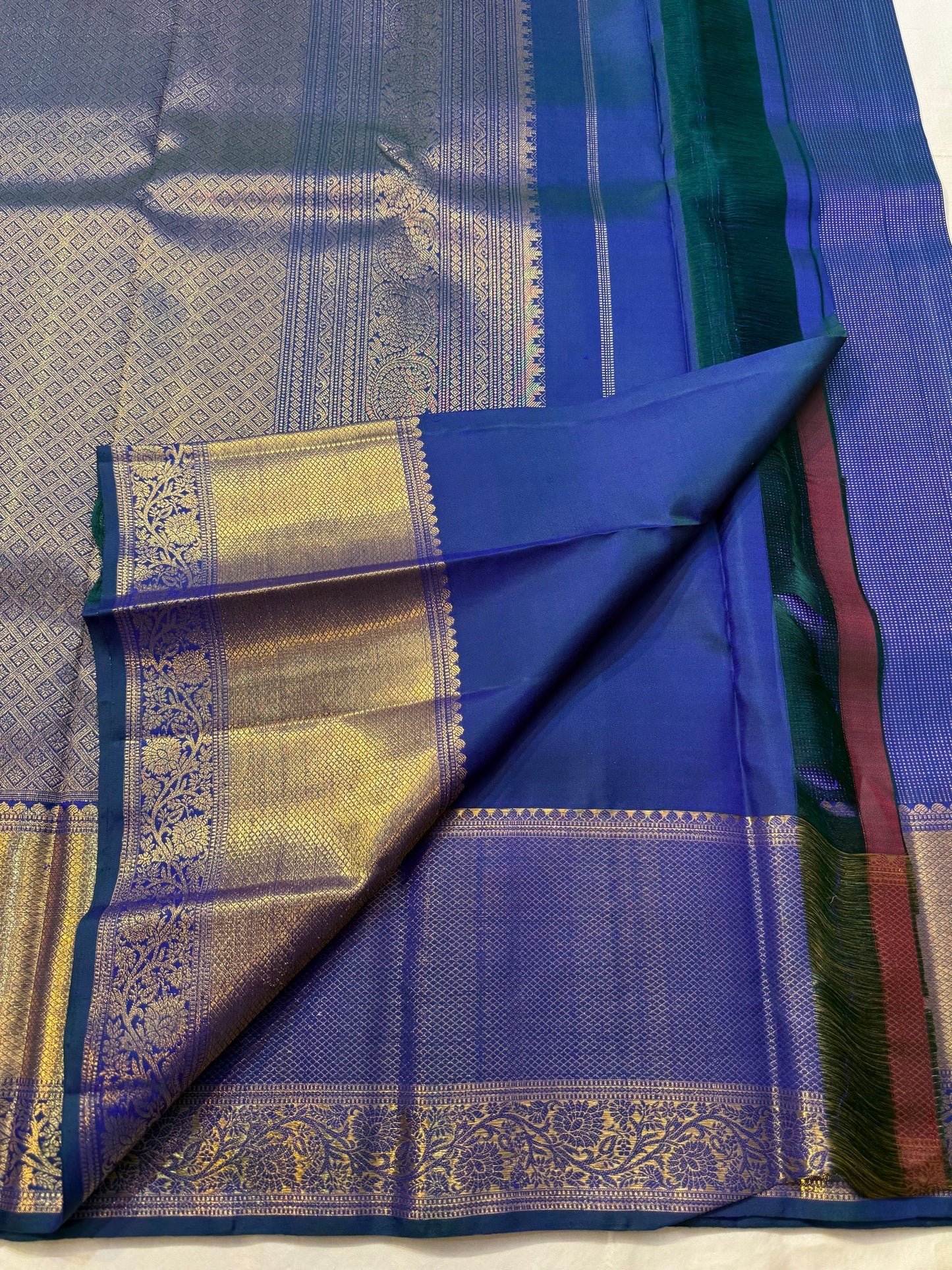 Navy blue Kanchipuram Zari Kattam saree folded flat — full length view