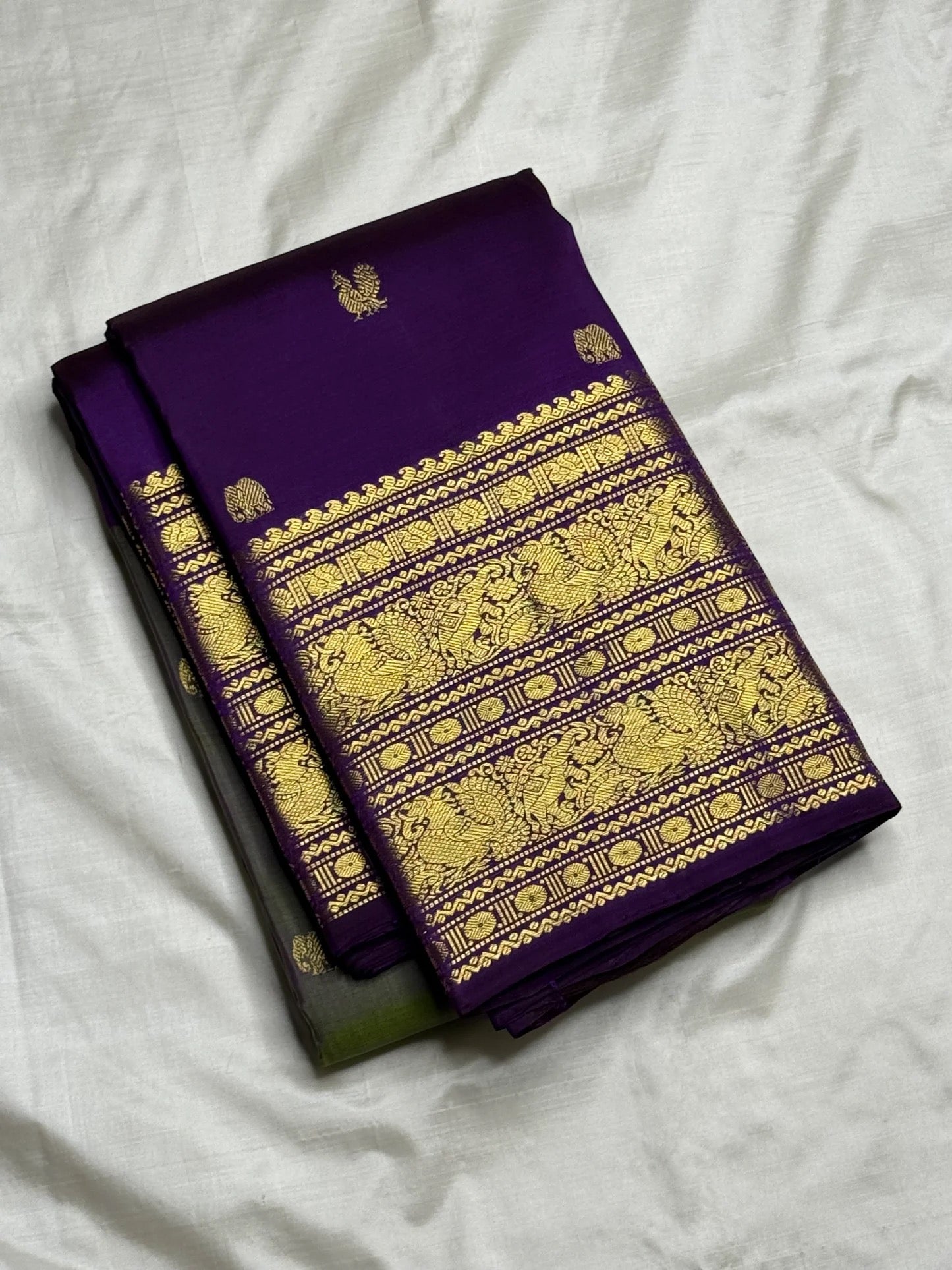 Olive green and purple Kanchipuram Korvai saree folded flat — full length view