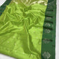 Full view of the Parrot Green handloom Pattu Silk Chanderi saree with silver buttas and forest green border