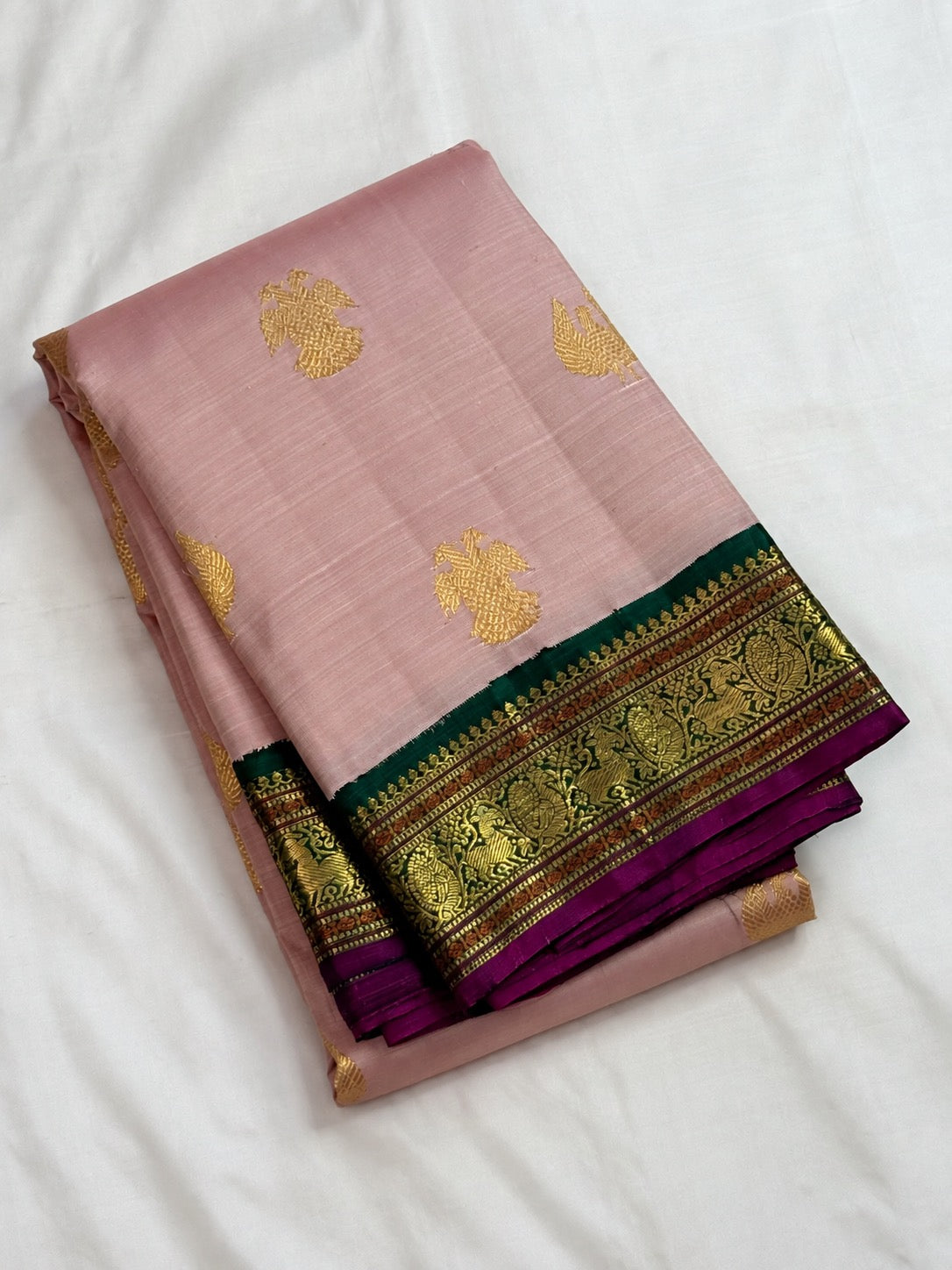 Petal pink handwoven pure silk Kanchipuram Kai Korvai saree with emerald green Gandaberunda zari border