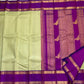 Deep purple pallu with gold zari Kili butta parrot motifs on Kancheepuram saree