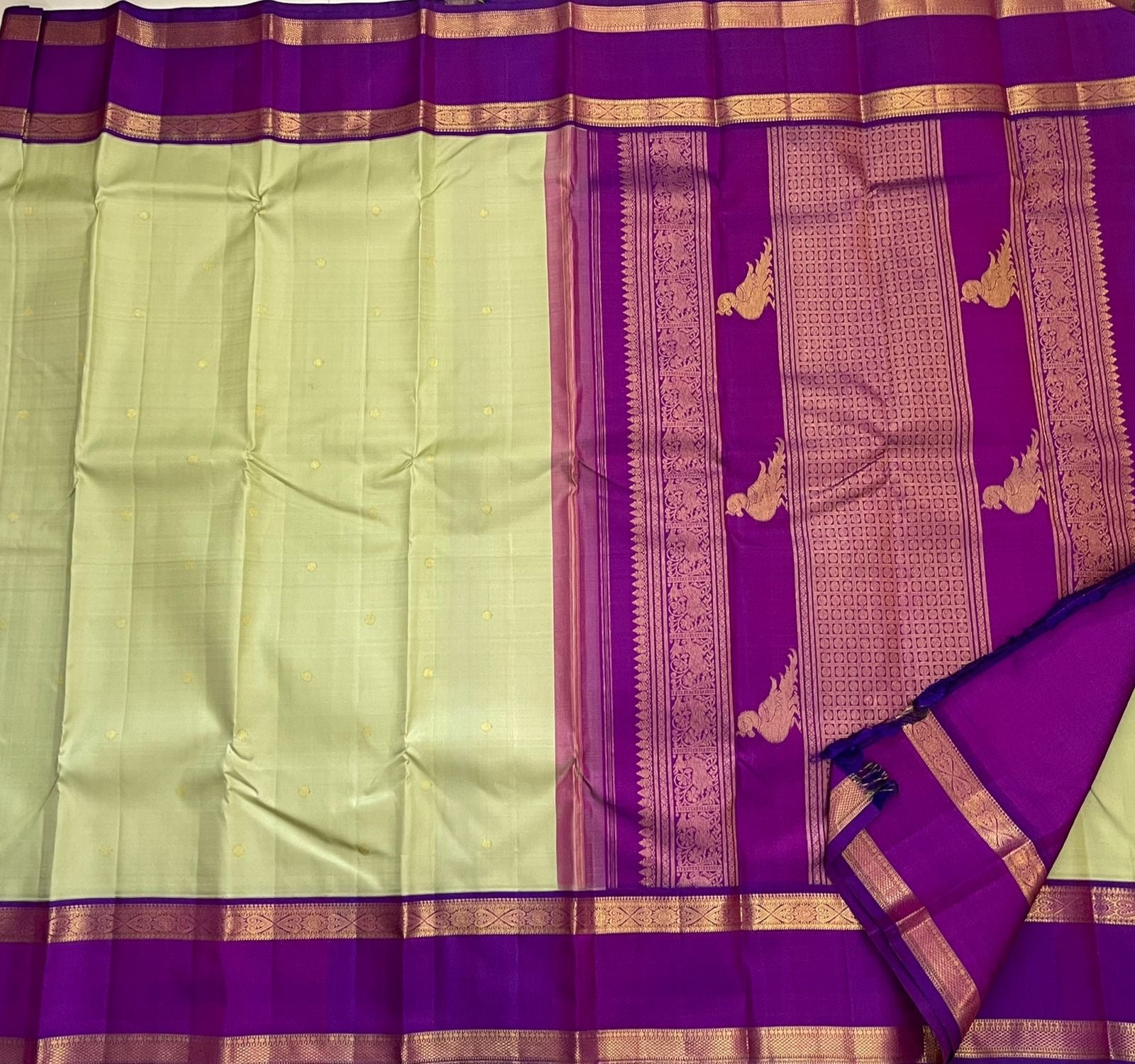 Deep purple pallu with gold zari Kili butta parrot motifs on Kancheepuram saree