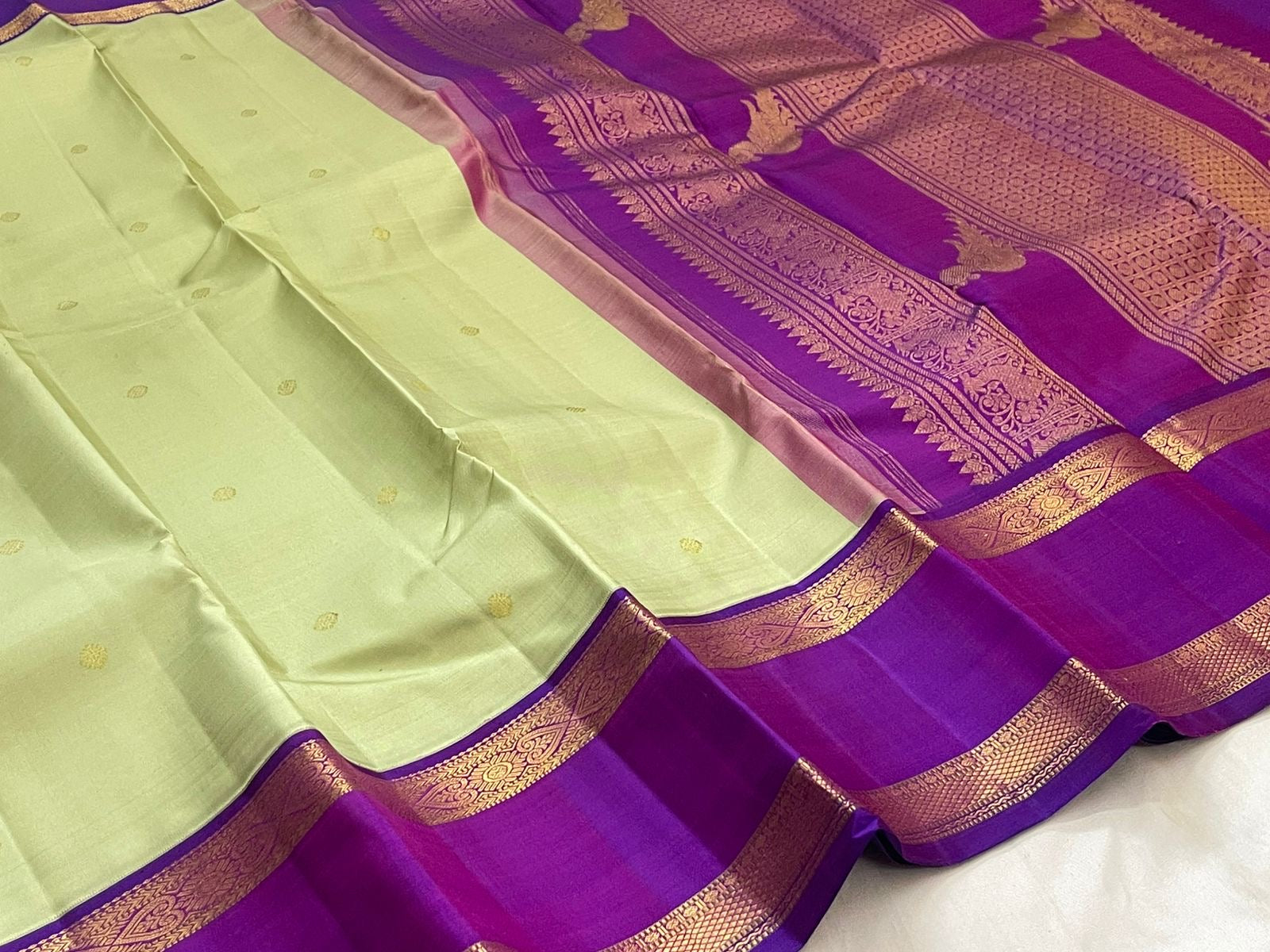 Pistachio green and purple Rettapet Kanjivaram saree folded flat view