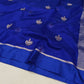 Model wearing Royal Blue Pattu Silk Chanderi saree with silver woven motifs, slim border and striped metallic pallu