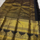 Pure Kanchipuram silk saree pallu spread showing gold zari panels, diamond pattern field, and black tassels, available in the USA