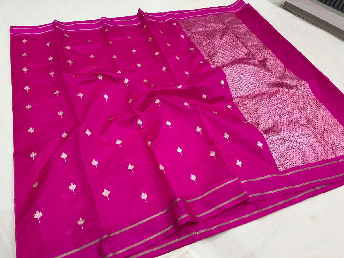 Close view of raspberry pink handloom Chanderi silk with delicate metallic lotus buttas