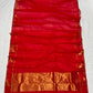 Full view of raspberry red Chanderi saree with spaced gold buttas, peacock motifs and gold-toned pallu