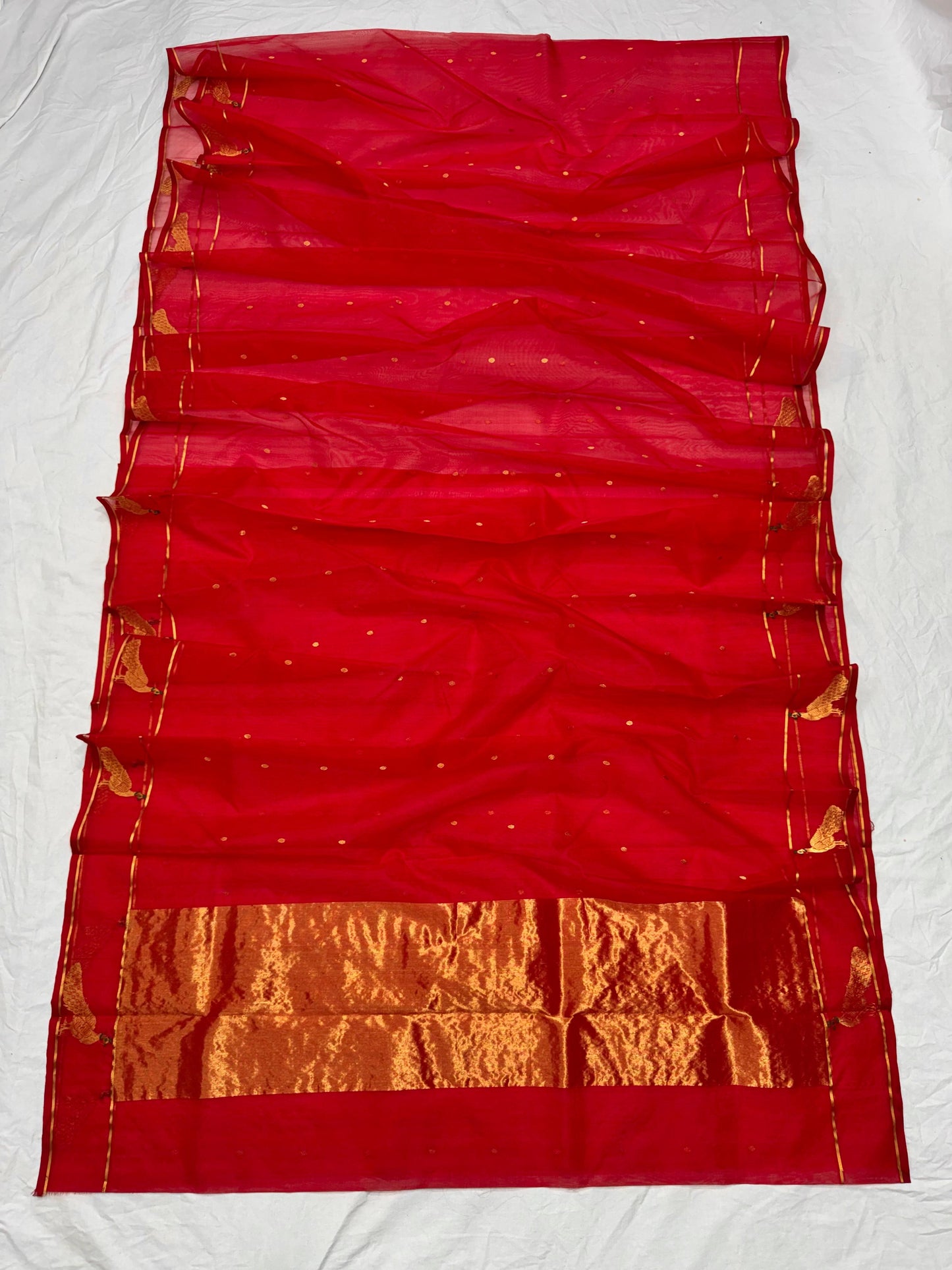 Full view of raspberry red Chanderi saree with spaced gold buttas, peacock motifs and gold-toned pallu