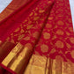 Close-up of deep red mulberry silk body with dense gold zari chrysanthemum Floral Jaal