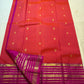 Wide magenta Varisaipet border with layered horizontal gold zari bands on red Kanchipuram silk