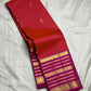 Red and magenta Kanchipuram Vairaoosi saree folded flat — full length view