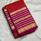 Deep orange-red Kanchipuram saree body with continuous Vairaoosi zari lines and Kamalam butta — close-up