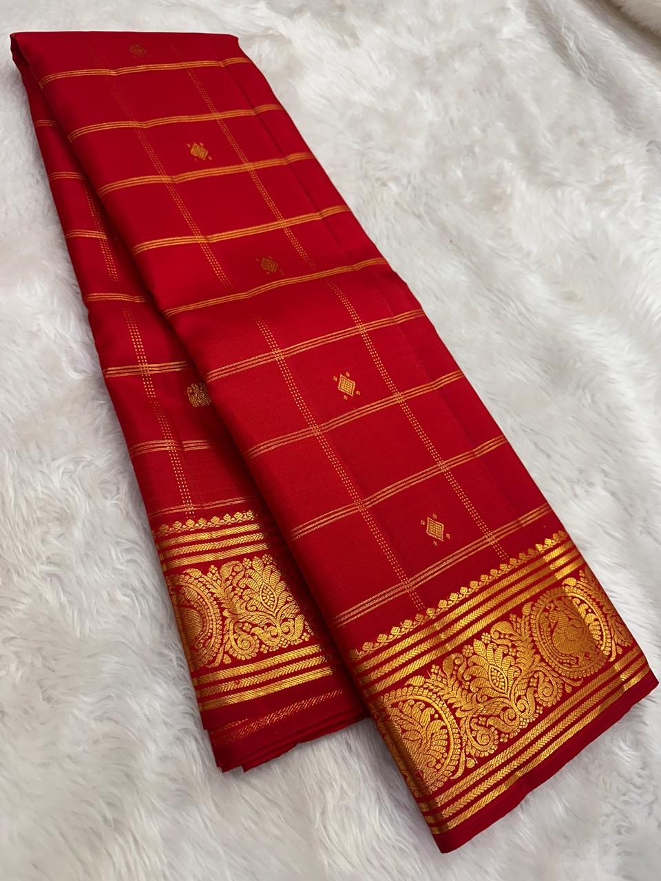 Red handwoven pure silk Zari Kattam Kanchipuram saree with gold zari grid overview