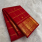 Close-up of deep red mulberry silk body with gold zari Zari Kattam intersecting grid
