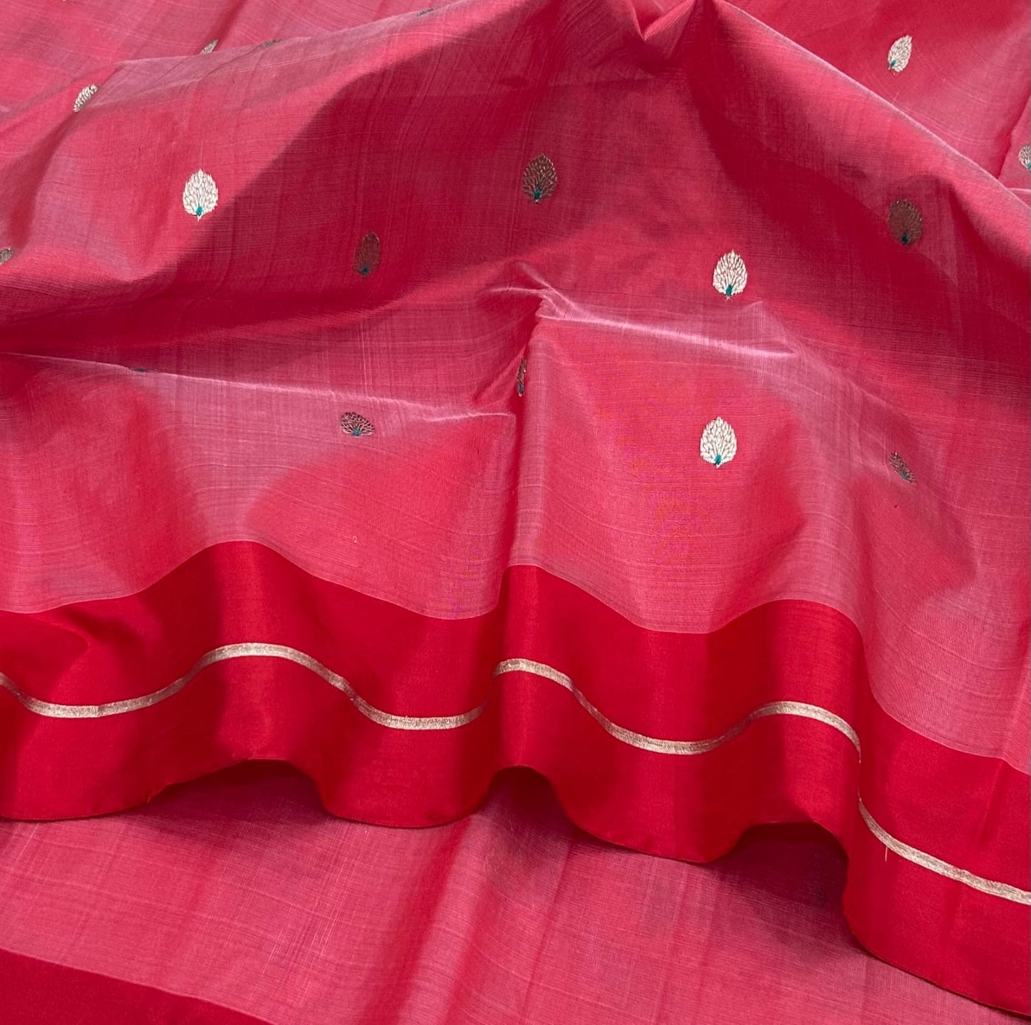 Rose pink Pattu Silk Chanderi saree with rich red border and delicate leaf-shaped woven buttas