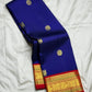 Royal blue and red Kanchipuram butta saree folded flat — full length view
