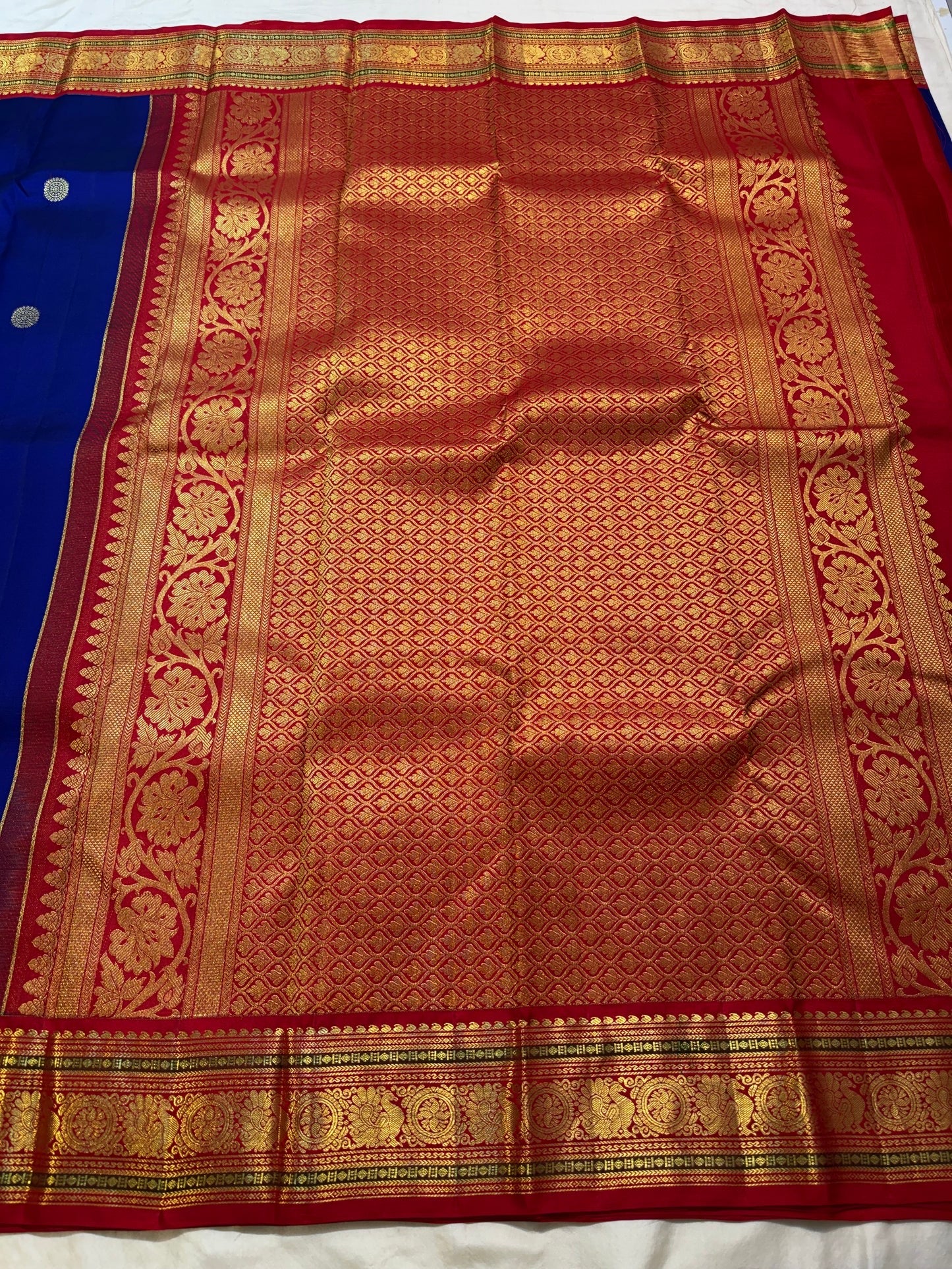 Royal blue and red handwoven pure silk Kanchipuram butta saree with Kamalam motifs and elaborate zari border — full overview