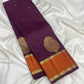 Peacock and diamond zari lattice pallu on an aubergine Kanjeevaram saree